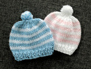 Two homemade knit hats for newborns