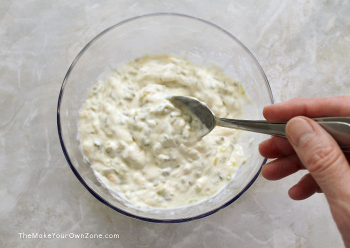 stirring homemade tartar sauce