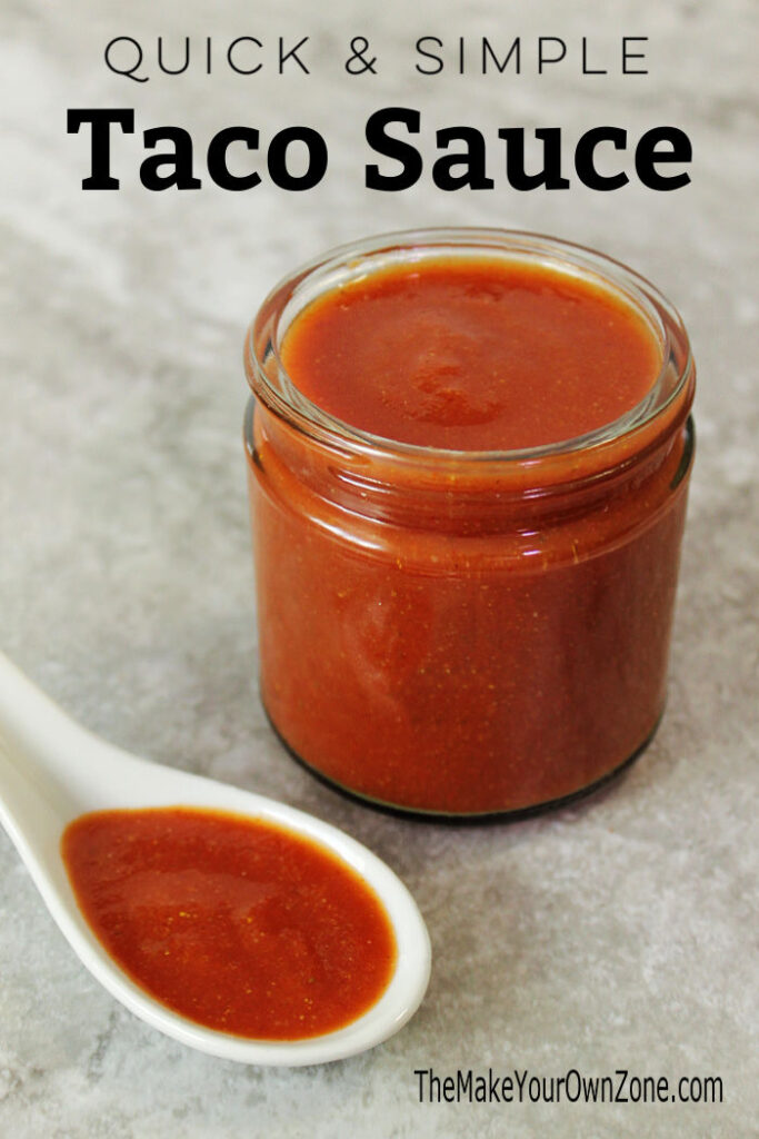 Jar of homemade taco sauce with spoon