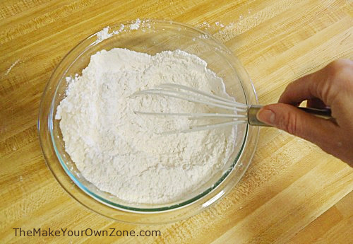 whisking homemade self rising flour