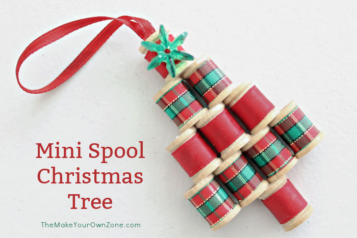 A christmas tree ornament made from mini wooden spools