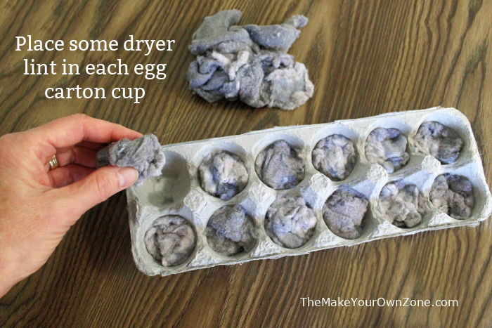 Filling an egg carton with dryer lint to make homemade fire starters