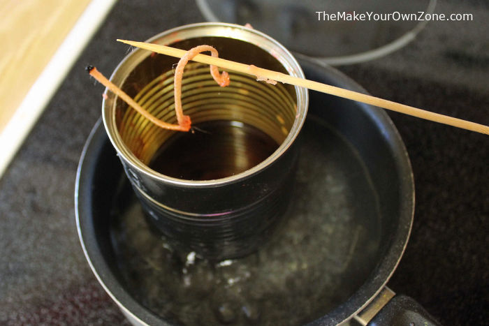 Melting old candles to make homemade fire starters