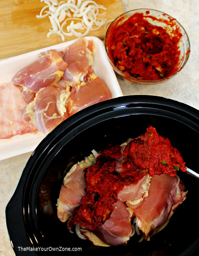 Putting ingredients for chicken cacciatore in a slow cooker