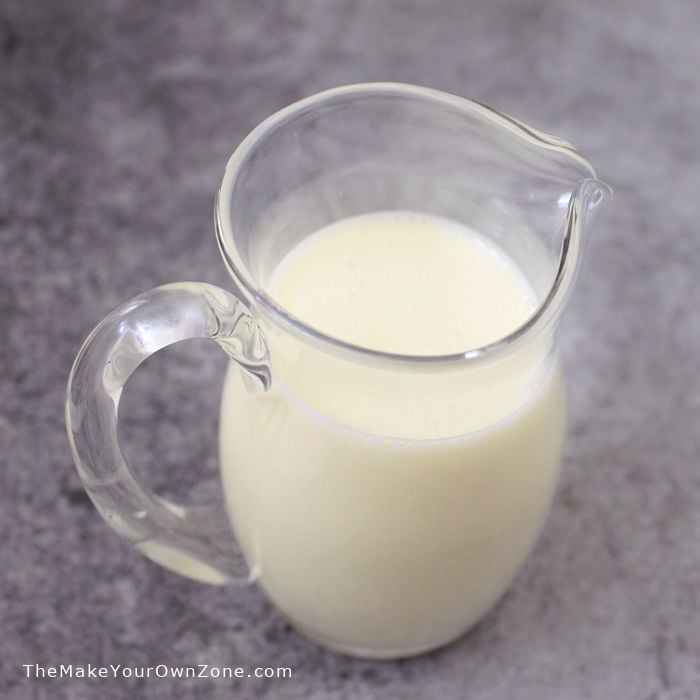 A pitcher of homemade sweetened condensed milk