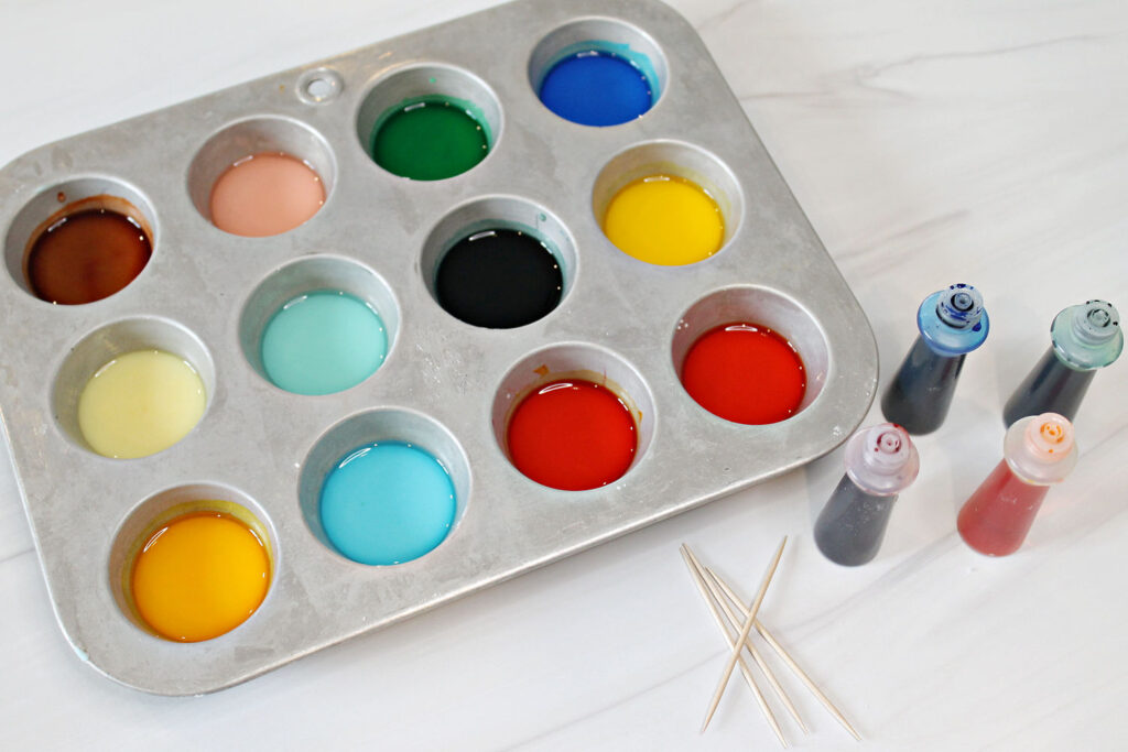 Homemade watercolor paints in a mini muffin pan