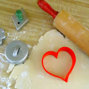 a rolling pin and cookie cutters