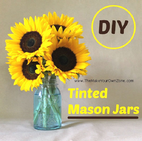 A tinted canning jar filled with sunflowers