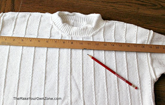 cutting a sweater to make a pillow