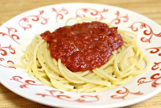 homemade red sauce on spaghetti