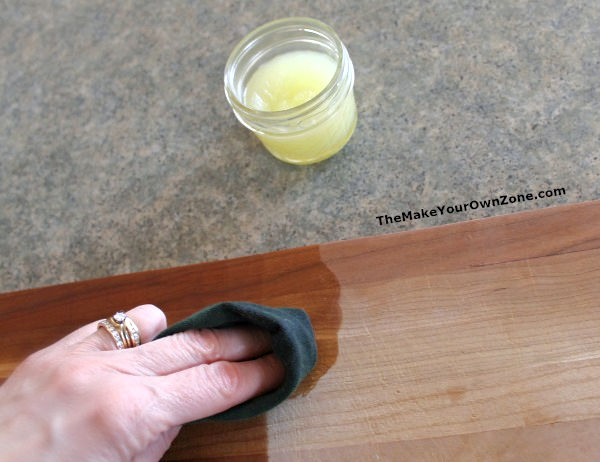 conditioning a wood cutting board with homemade cream