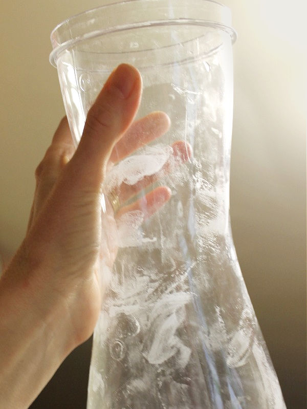 A container with cloudy residue after washing