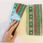 folding gift wrap to make a gift bag