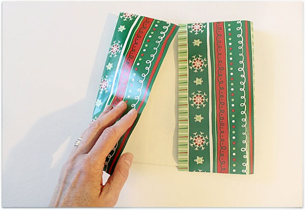 folding gift wrap to make a gift bag
