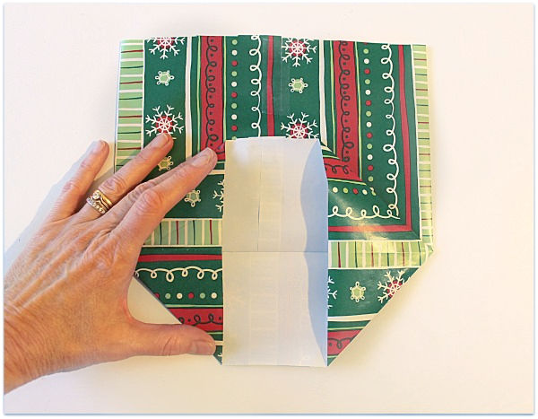 folding gift wrap to make a gift bag