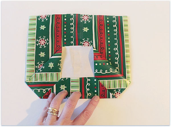 folding gift wrap to make a gift bag