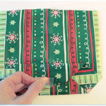 folding gift wrap to make a gift bag