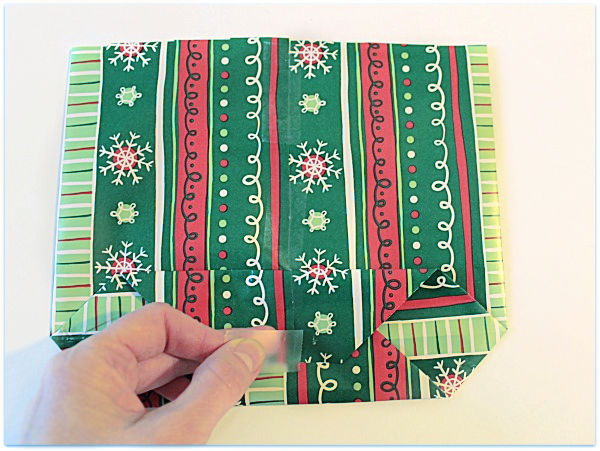 folding gift wrap to make a gift bag