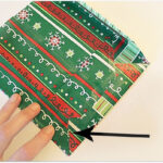 folding gift wrap to make a gift bag