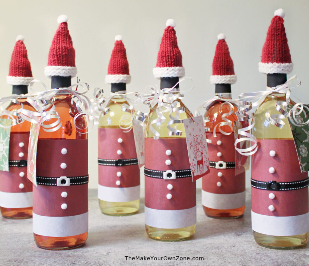 wine bottle with knit Christmas santa hats