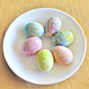 decorating Easter eggs with crayon