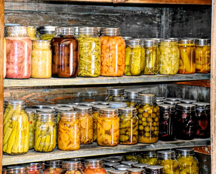 canned produce in canning jars on shelves