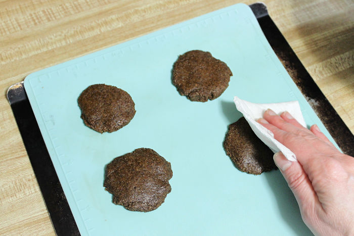 molasses cookies on a cookie sheet