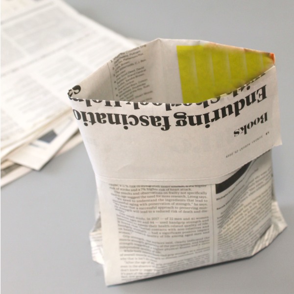 a bag made with folded newspaper