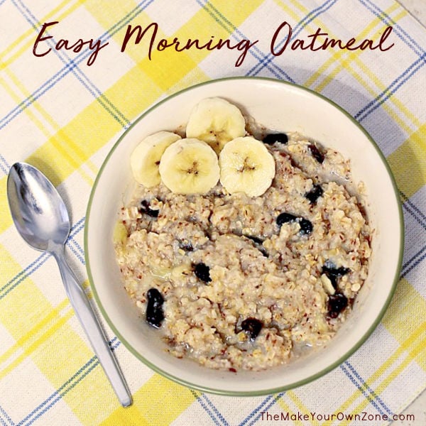 a bowl of oatmeal with bananas and raisins