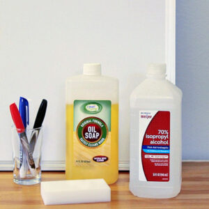 using a magic eraser to clean a whiteboard