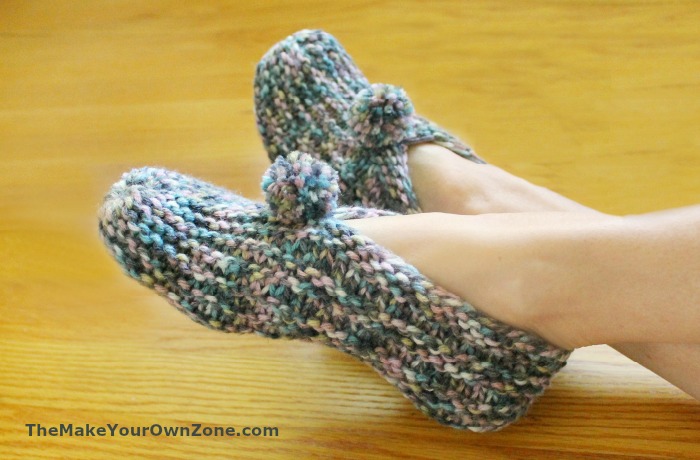 Knit slippers with pom poms