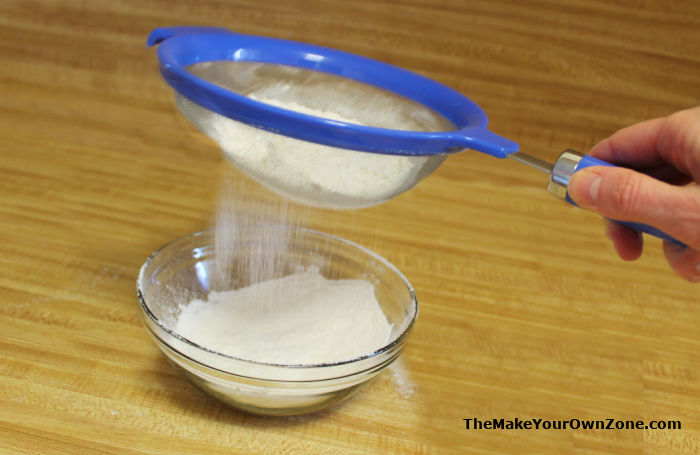 Using a sifter to make homemade cake flour