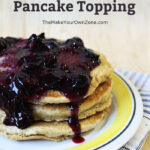 Stack of pancakes with homemade blueberry syrup topping