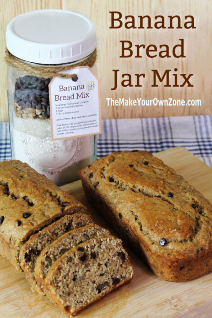 Banana bread mix in a jar with baked loaves of homemade banana bread