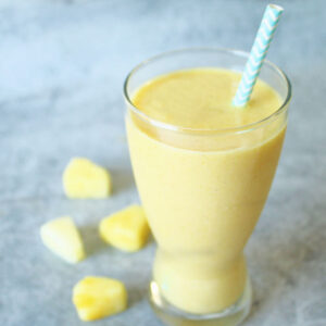 a smoothie made with banana, pineapple, and turmeric