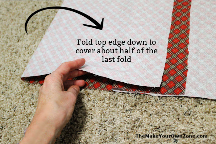 Folding fabric to make a Christmas pillow slip cover