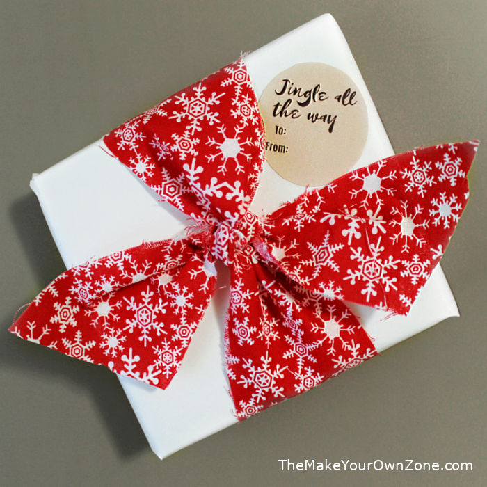 A gift box tied with a ribbon made from fabric scraps
