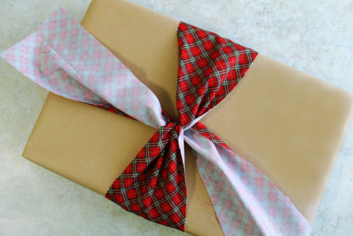 wrapping a box with fabric ribbon