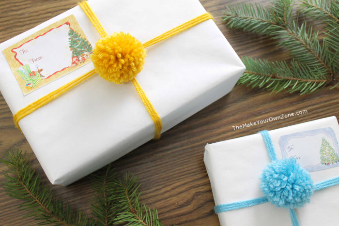 gift wrapped packages decorated with pom poms