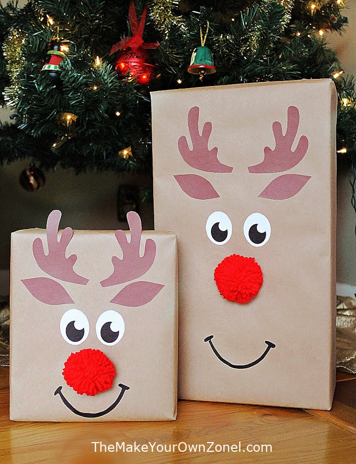 gift wrap packages that look like reindeer under a Christmas tree