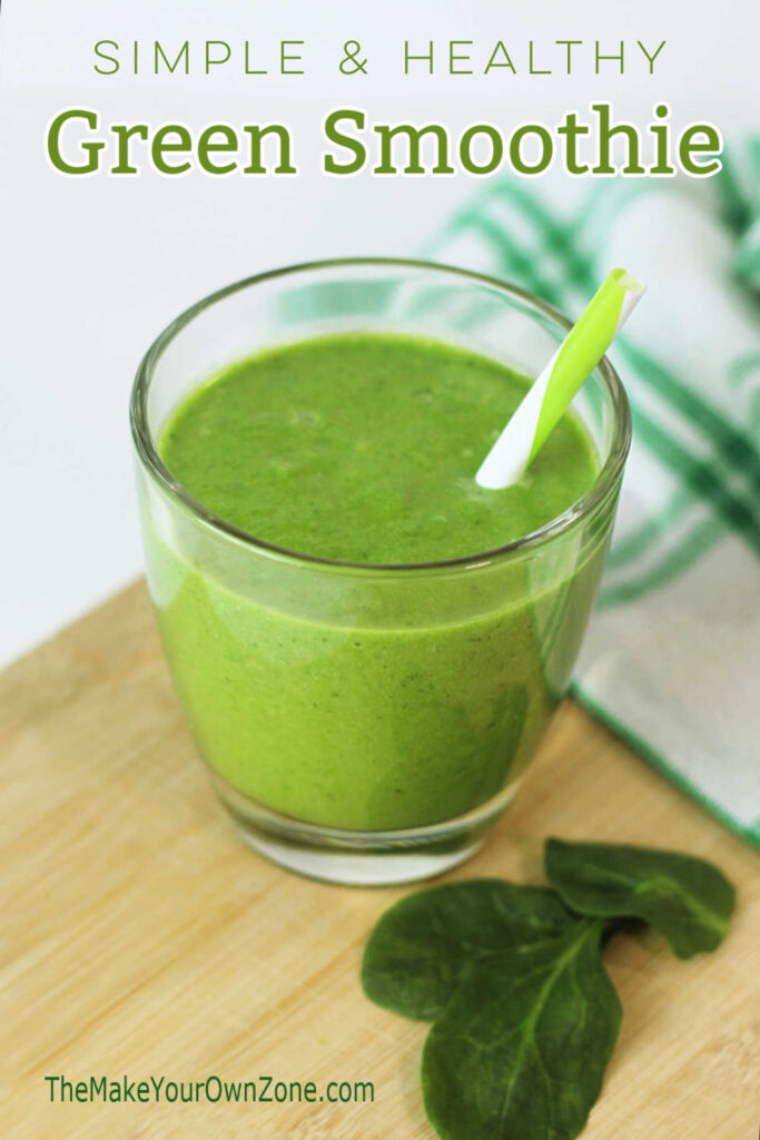 A green smoothie in a glass with a straw