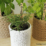 knit plant cozy with plant sticks