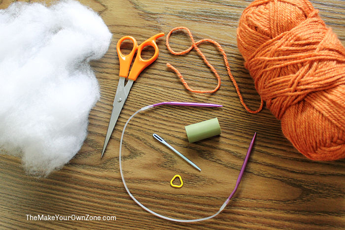 Knitting supplies for making a homemade knit pumpkin.