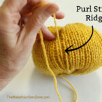 Making a homemade knit pumpkin.