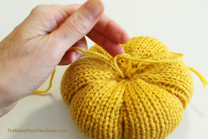 Making a knit pumpkin.