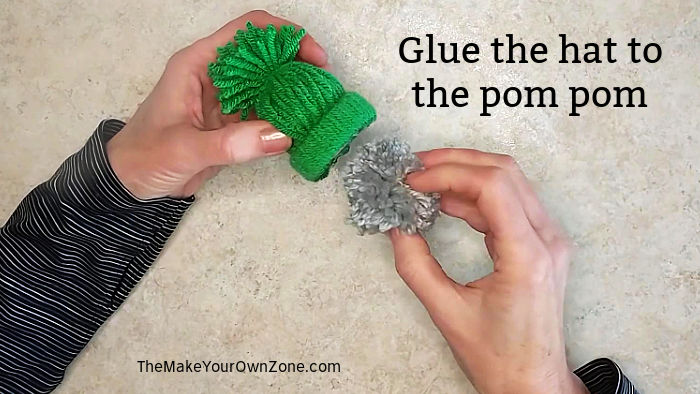 making a gnome ornament with a yarn hat and yarn pom pom.