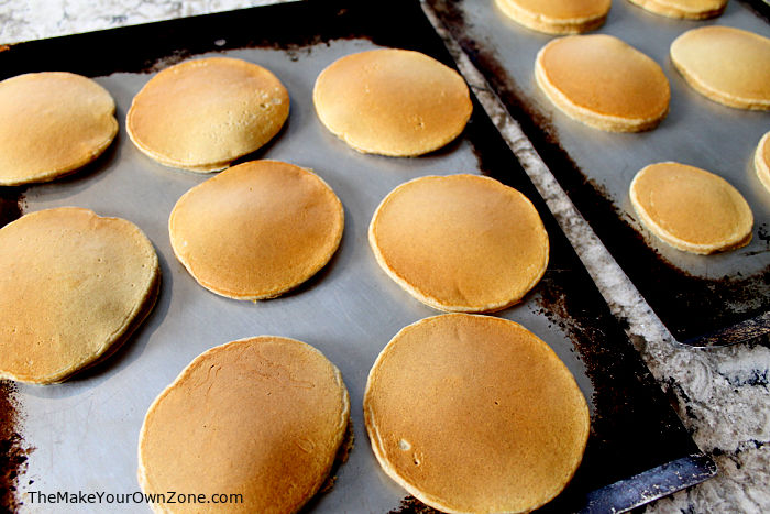 pancakes on a cookie sheet to be frozen