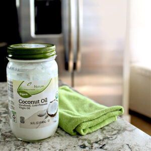 A jar of coconut oil for cleaning stainless steel