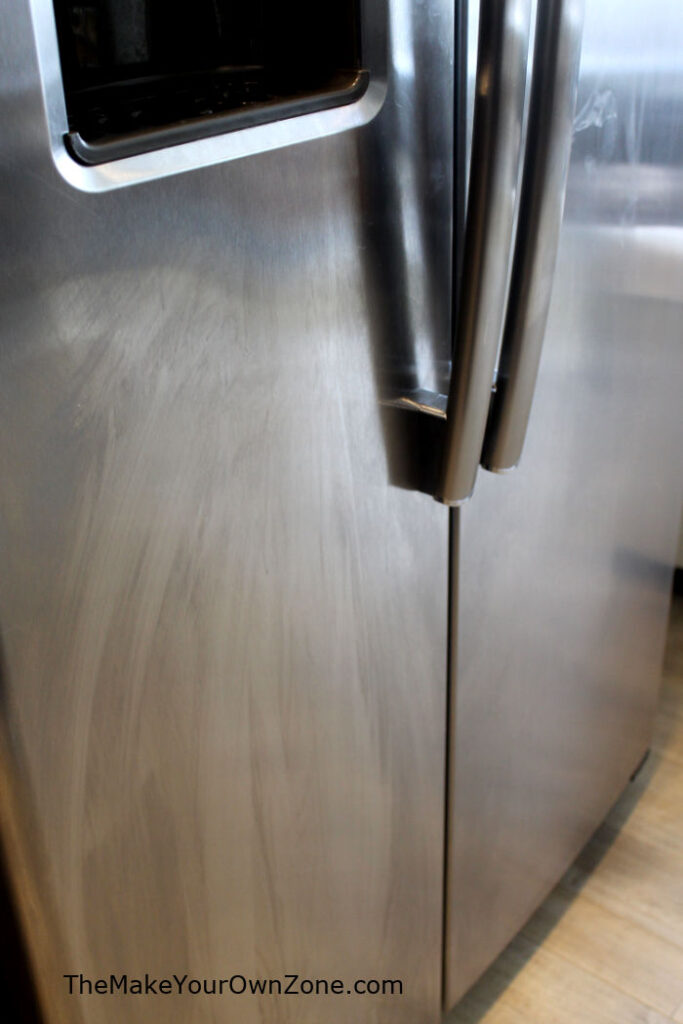 A stainless steel refrigerator door with streaks
