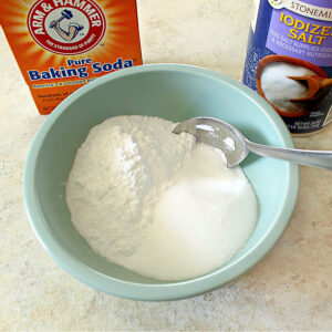 Mixing baking soda and salt to make homemade scouring powder